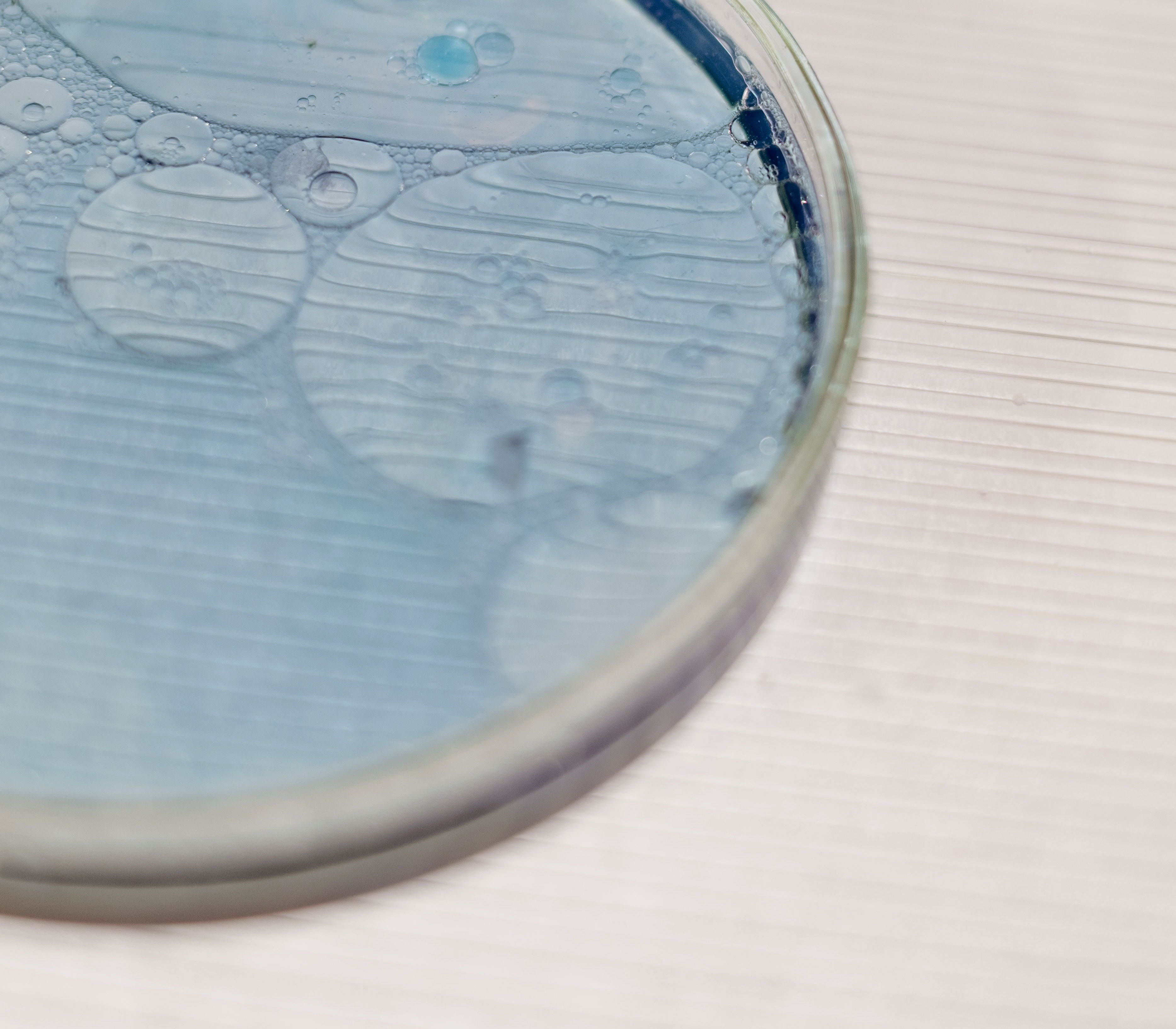 Close-up of pale blue water and bubbles