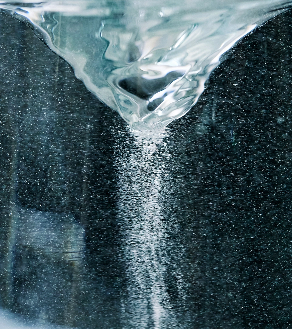 Water flowing over a dark surface